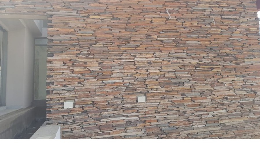 Stone cladding wall completed by Yarona